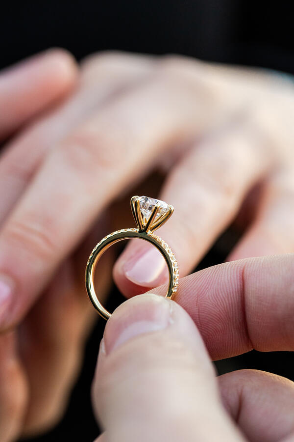 Close-up of engagement ring during a surprise proposal photoshoot in Rome