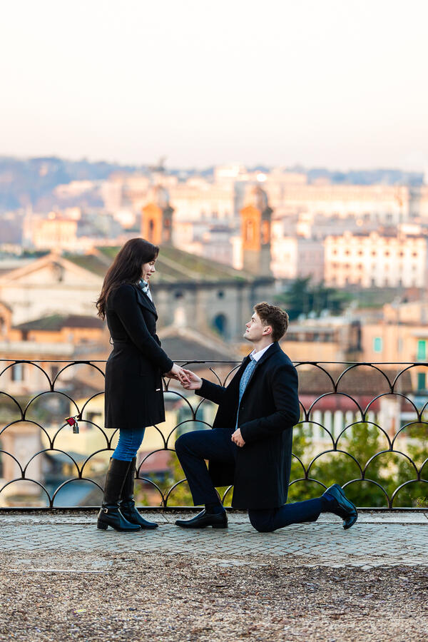 Surprise proposal at sunrise on the Terrazza Belvedere in Rome