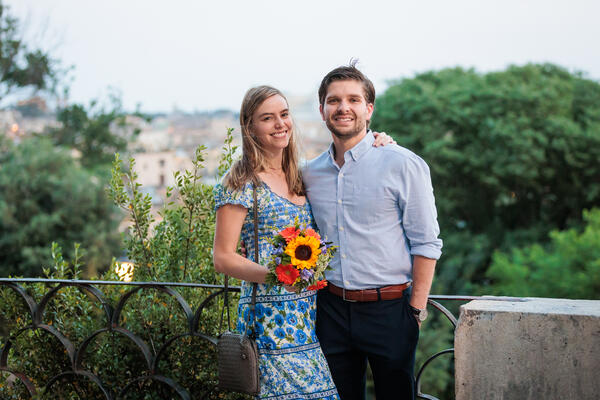 Happy newly-engaged couple on the Terrazza Belvedere during their surprise proposal photo session in Rome