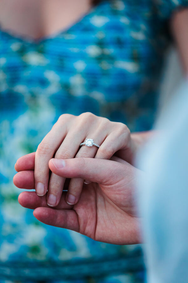 Close up of an engagement ring on surprise propsal photo shoot in Rome