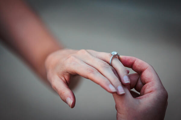 Engagement ring on a the fiancée's finger